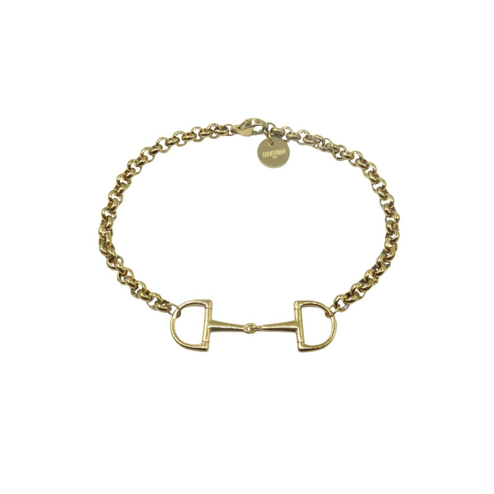 Gold-tone chain bracelet with a horse bit centrepiece and a small round tag engraved with EQUESTRIAN.